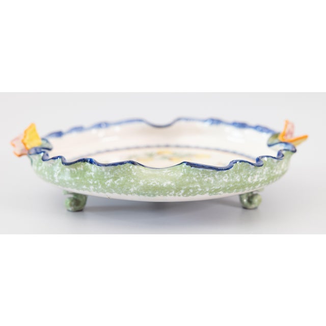 A charming antique French faience Quimper pie crust footed plate or dish, circa 1895. Maker's mark on front and reverse....