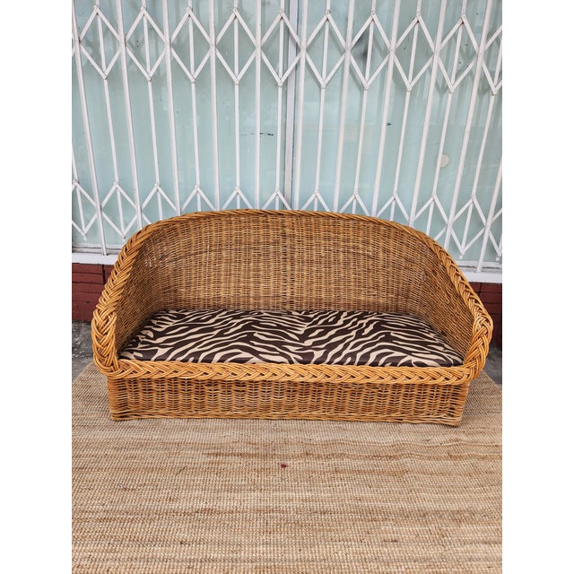 Italian wicker loveseat. Has cool zebra print cushions. Frame is sturdy. Cushions are comfy. Great for a patio or living...