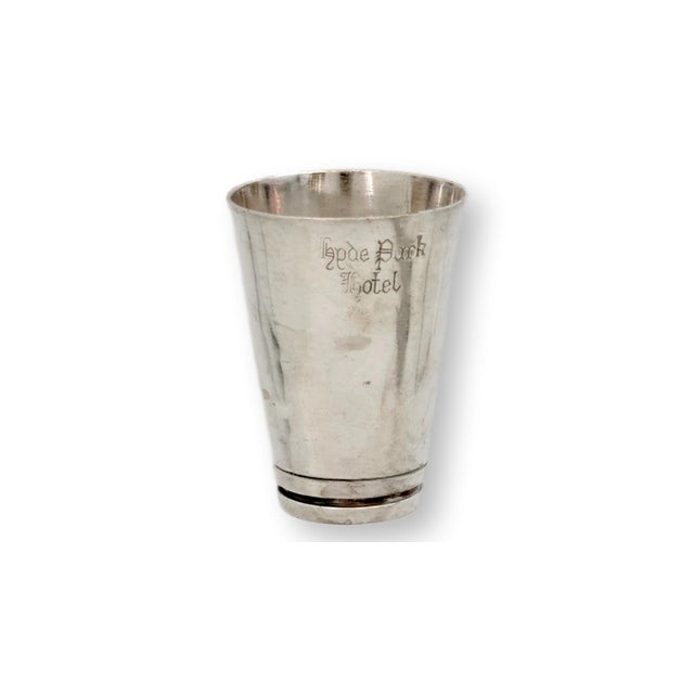 English hotelware cocktail jigger engraved for the Hyde Park Hotel, London. This petite silverplate bar measure captures...