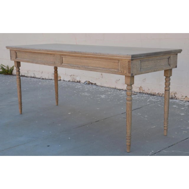 This rift sawn oak desk has turned legs and two drawers. It is seen here in 68" x 27" x 30" H, however it can be built in...