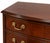 Handsome traditional four-drawer chest featuring richly figured mahogany-toned wood, a gently bowed front and classic...