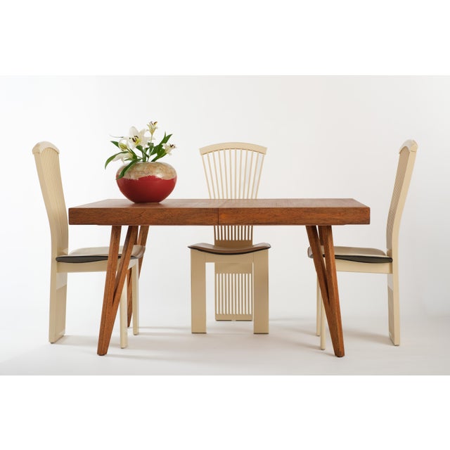 Four Italian dining chairs by Pietro Costantini, imported by Ello, circa 1970s/1980s. The curved seats are generous and...