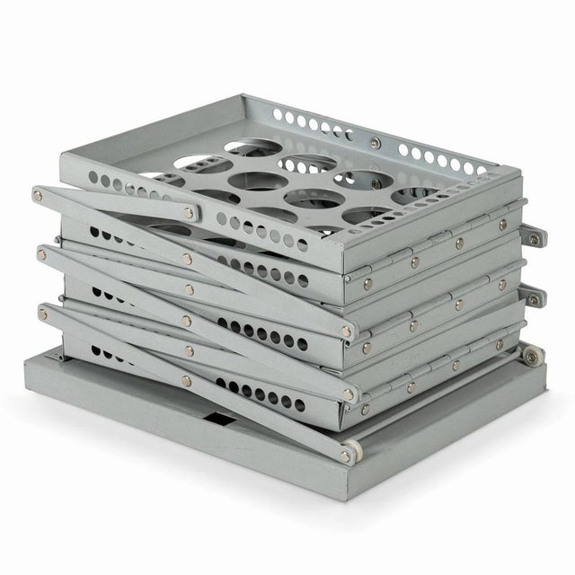 Iconic steel newspaper stand with powder coating. The zig-zag design offers three levels and a total of six compartments...