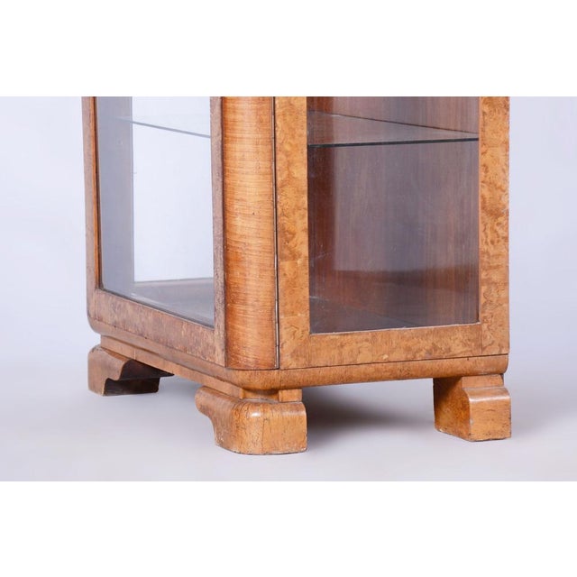 Restored Art Deco Display Cabinet Designed by Jindrich Halabala Designer: Jindrich Halabala Maker: UP Zavody Source:...