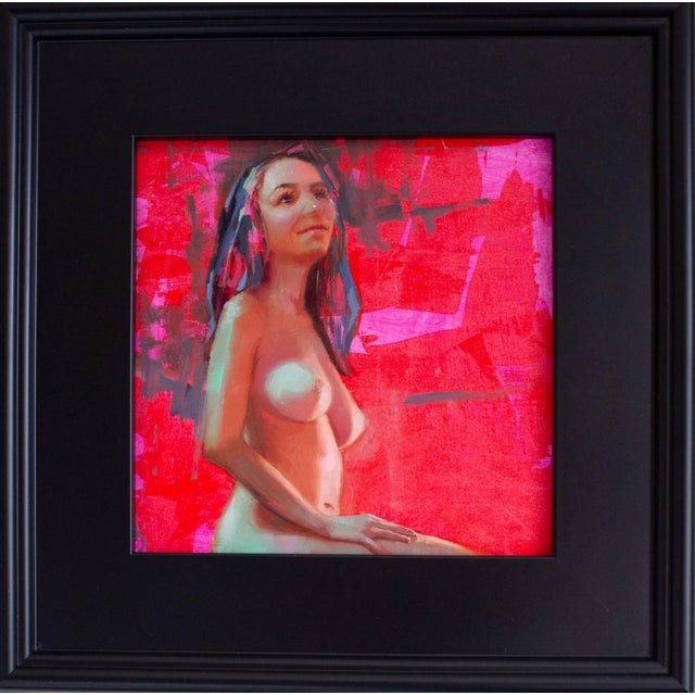 This oil on panel artwork presents a seated figure, bathed in vibrant hues of red and pink that create a dynamic...
