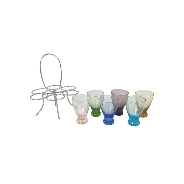 1960's glassware set with caddy. Set includes six multicolor shot glasses with metal caddy. No maker's mark. Minimal age...