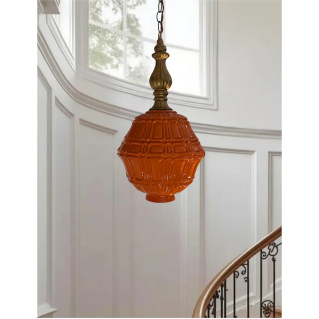 This one-of-a-kind 21‑inch by 12‑inch pendant light has a striking mid‑century presence, built around a heavy...