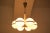 This mid-century chandelier in the style of Rupert Nikoll was manufactured in the 1960s. It is made of steel, brass, and...