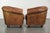 This rugged set of vintage sheepskin club chairs has a beautifully weathered look and is finished with decorative studs....