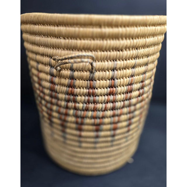 Large Hand Woven African Coil Basket With Earth Tone Geometric Pattern This impressive, large-scale African coil basket is...