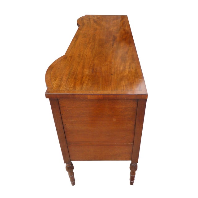 For sale is a good quality George III mahogany sideboard. The sideboard has three drawers across the top, each with ring...
