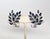 Circa 1957 rhodium plated pear shaped faux-sapphires with channel set clear baguettes leaves clip back earrings. Marked...