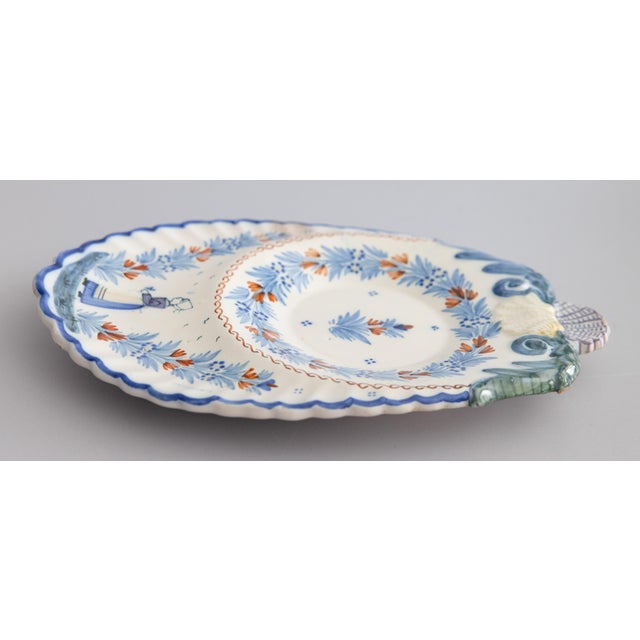 A superb antique French provincial faience Henriot Quimper scalloped wall platter or dish, circa 1920. Maker's mark on...