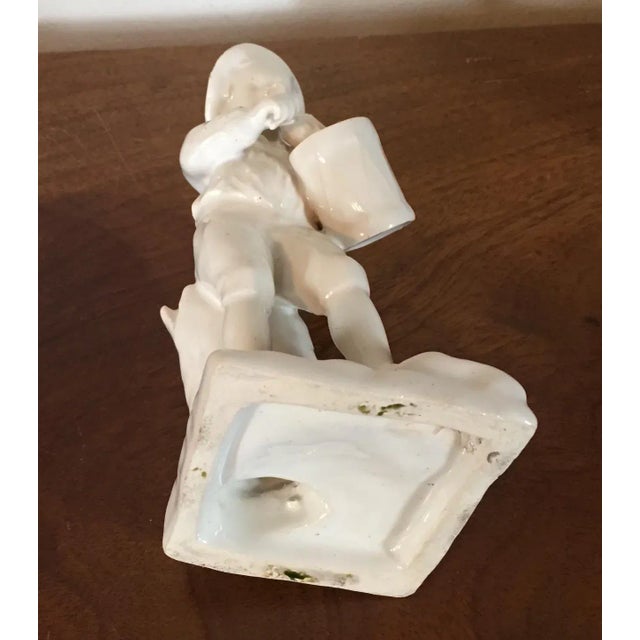 Antique 18th c. English Staffordshire white pearlware figure of a boy playing a flute and carrying a drum at his side....