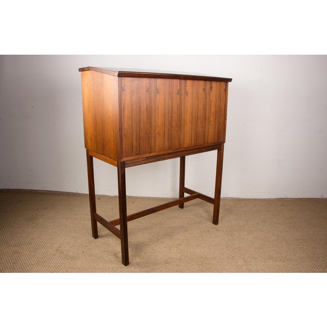 Exceptional Scandinavian multifunctional furniture. A fold-out tray, held by brass tenons, opens onto a secretary section...