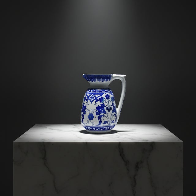 The Elegance of Azure This Handmade Ceramic Pitcher Vase captures the calming essence of the Mediterranean. Standing at 20...