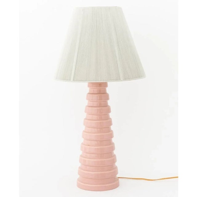 Pair of Art Deco Pale Pink Glazed Ceramic Table Lamps, with later green string shades. 27.75" H x 14" Diameter....
