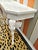 A gorgeous vintage Demi-lune Gampel-Stoll style Elephant hall table done in white high gloss. This table has amazing...