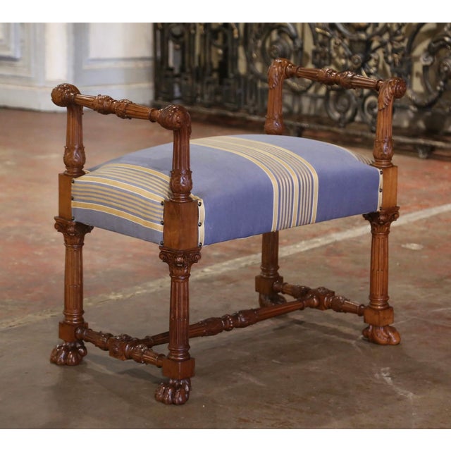 This elegant vintage fruit wood bench was crafted in Italy, circa 1970. The antique seating stands on fluted legs ending...