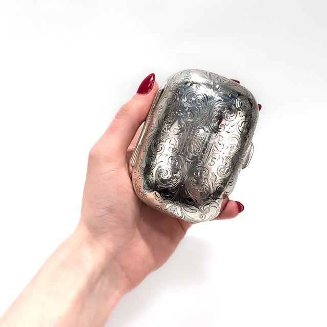 A fine antique silver box. By Tiffany & Co. In sterling silver. With a gilt interior and engraved foliate swags to the...