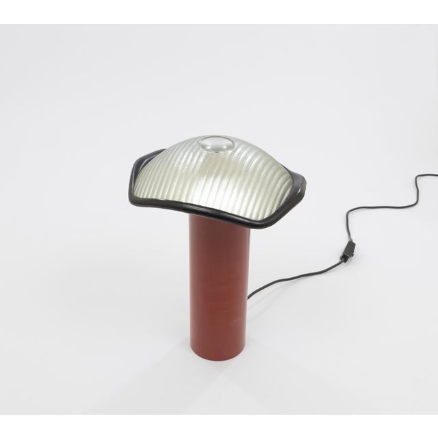 Brontes table lamp, designed by Cini Boeri and produced by Artemide. The model consists of a heavy red lacquered...