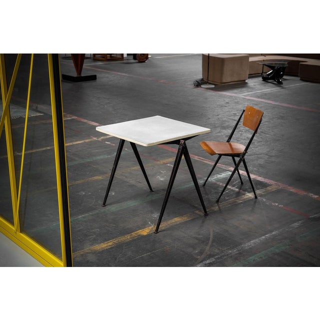 This rare ‘Pyramid’ table, designed by Wim Rietveld and produced by Ahrend de Cirkel in the Netherlands in 1960, is a...