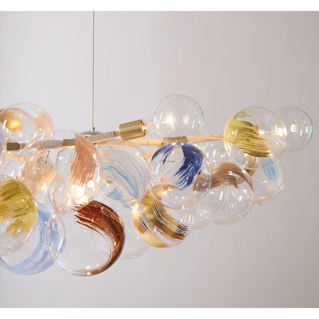 PELLE "STROKES LONG 80-BUBBLE CHANDELIER" The Strokes Long 80 Bubble Chandelier, designed in 2013, is a variation on the...