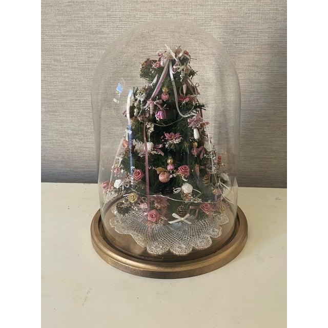 Unique handmade vintage miniature Christmas Tree with handmade ornaments with lights in a glass dome Probably by renown...