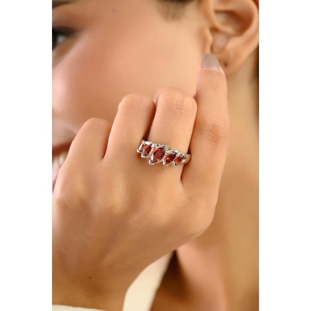 Make a bold statement with this Five-Stone Marquise Garnet Ring in solid 925 silver, showcasing five dazzling garnet...