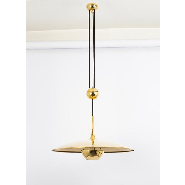 Stunning adjustable counterweight brass pendant lamp onos by florian schulz germany 1970s it is a masterpiece of design...