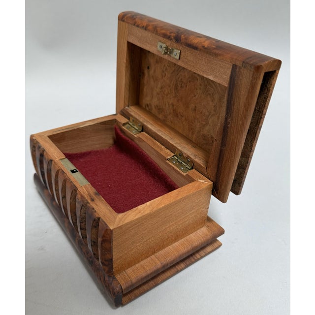 A captivating and finely crafted vintage Moroccan box, made circa 1900, fashioned from richly figured burled Amboyna wood....