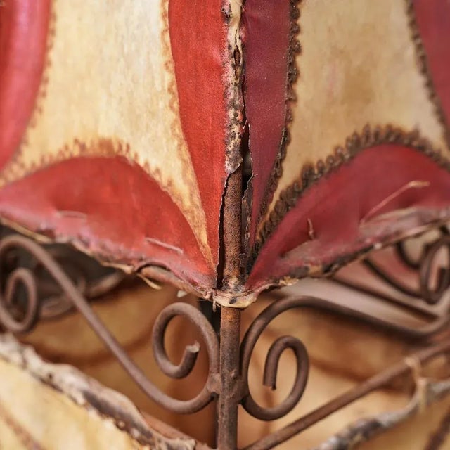 Ethnic leather lamp painted and iron height: 179 width: 35 This piece is attributed to the mentioned designer/maker. It...