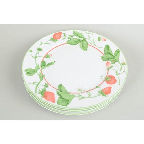 Bill Goldsmith for Limoges, Fraise, set of 4 charger plates. Set of four large porcelain charger plates decorated with...