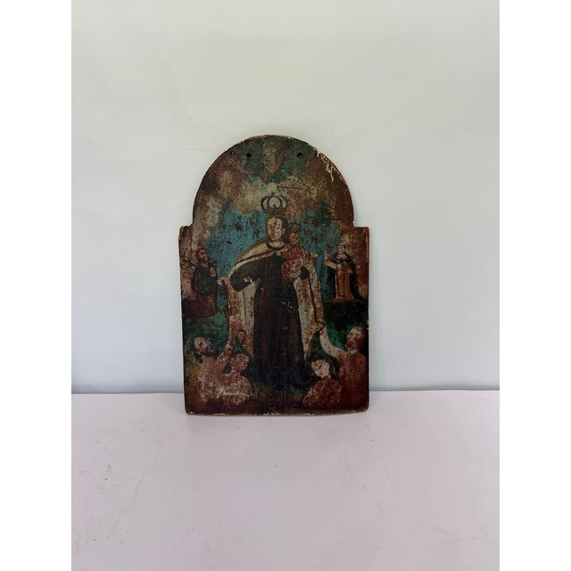 Authentic early 19th-century Spanish Colonial devotional retablo depicting Our Lady of Mount Carmel crowned and holding...