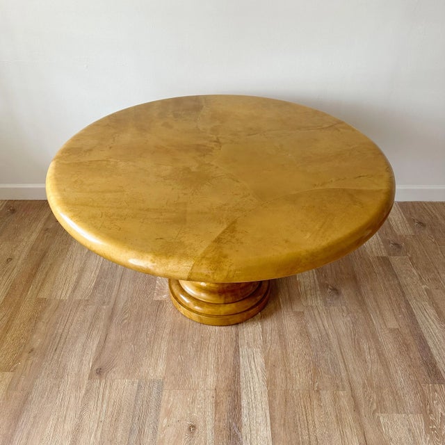 Jimeco parchment center table with circular goatskin top and pedestal with parchment overlay. Vintage item from the 1980s,...