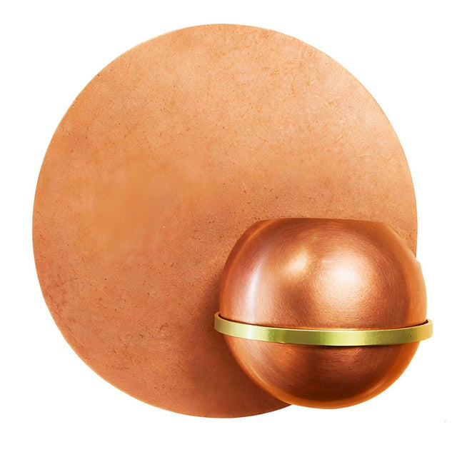 A unique pair of 1937 Art Deco wall planters crafted from copper and brass. This Modernist set includes two wall platters,...