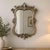 Bring classic European romance and drama to your interior with this stunning vintage wall mirror by Decoline New York....