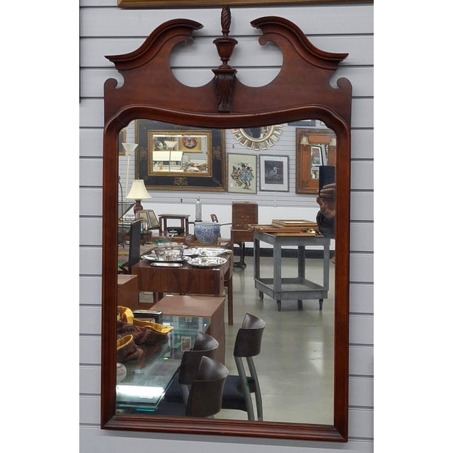 A Mid 20th Century Federal Style Mahogany Frame Mirror Measures 24" in width, 41" in height.