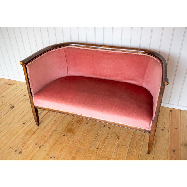 A rare and exceedingly charming edwardian art nouveau mahogany inlaid settee in lovely antique condition. Made in london...