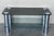 Mid-Century Modern chrome coffee table with smoked level up glass top and clear glass in low shelve. Details Dimensions...