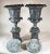 A Pair of Pompeian-Style Patinated Bronze Urns. These beautiful urns have acanthus leaves, grapevines, finial cap tops,...