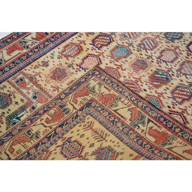 This extremely desirable east Caucasian finely woven piece, better for the wall, has a light straw-yellow ground with rows...