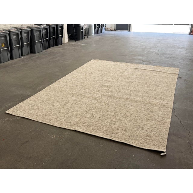 Design Plus Gallery presents a 9ft x 12 ft Modern Design Textured Neutral Area Rug. This contemporary rug has a low-...