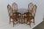 The Mid Century Italian set of four chairs and table from the 1970s, crafted in giunco wood, exudes a rustic charm and...