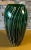 Standing att 11 inches tall, this hand-blown art glass vase was crafted from captivating emerald green glass, it boasts a...