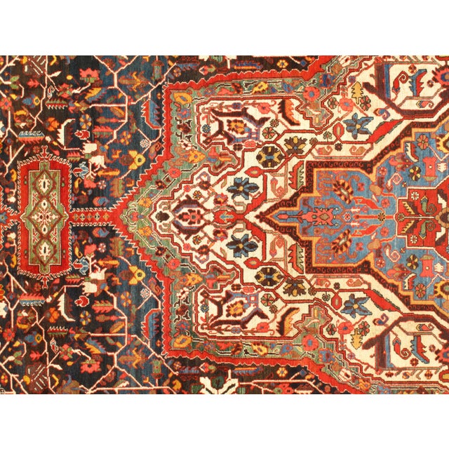 Offered is a gorgeous Persian Bakhtiari area rug. The luxurious hand-knotted pile is made from very fine lamb's wool and...