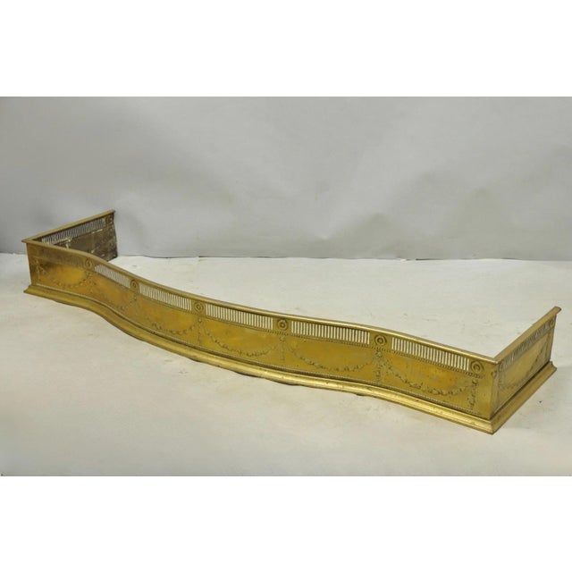 Antique English Victorian Serpentine Drape & Bellflower Brass Fireplace Fender with Remarkable Patina. Circa Late 19th...