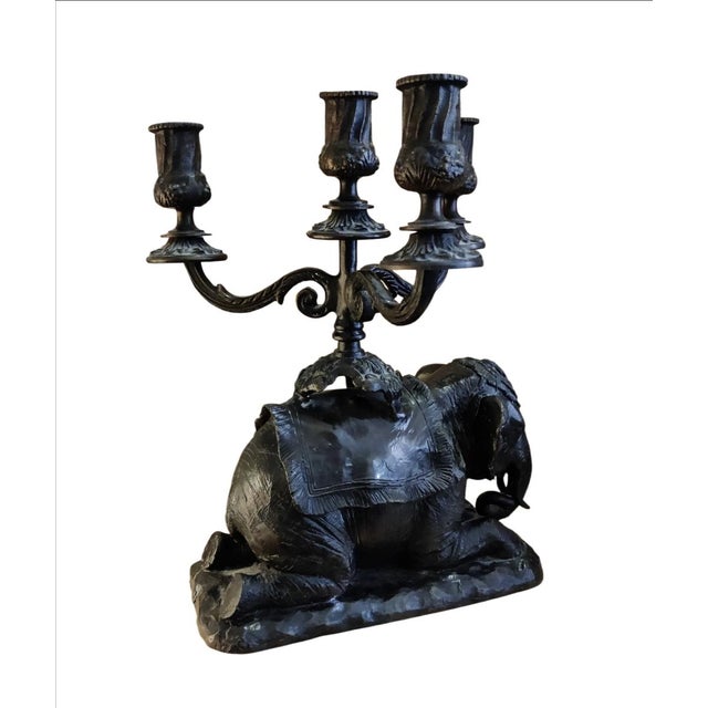 For your consideration . . . A vintage ornate four-arm elephant candelabra made of heavy weight patinated metal with a...