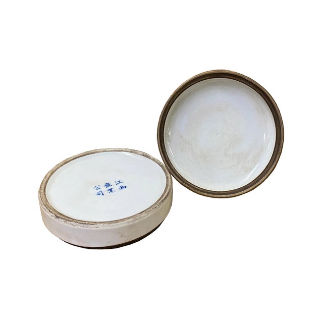 This is a Chinese decorative porcelain round box in Blue and White color finish. The theme is oriental scenery graphics....