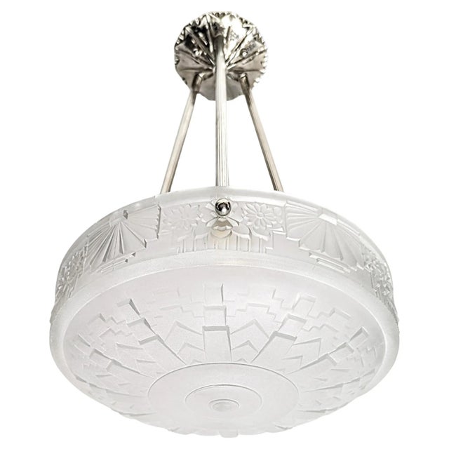 A French Art Deco pendant chandelier by "Lorrain Nancy France" in great condition. Clear frosted molded glass shade with...